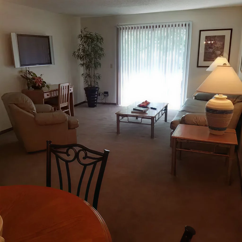 Bright apartment living room at Walnut Gardens Apartments