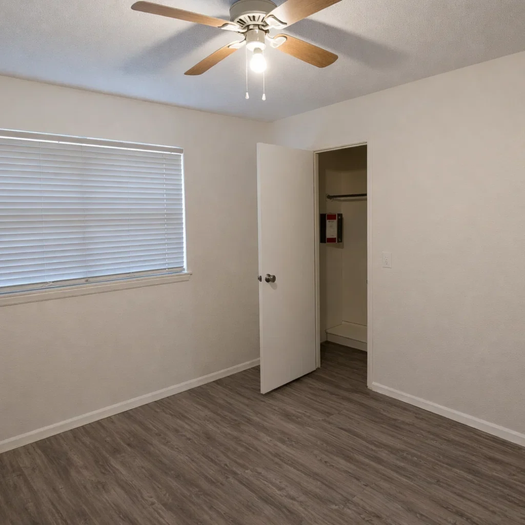 Comfortable Bedrooms at La Villa Elms Bedroom with ceiling fan and open walk-in closet in La Villa Elms Apartments located in El Reno.